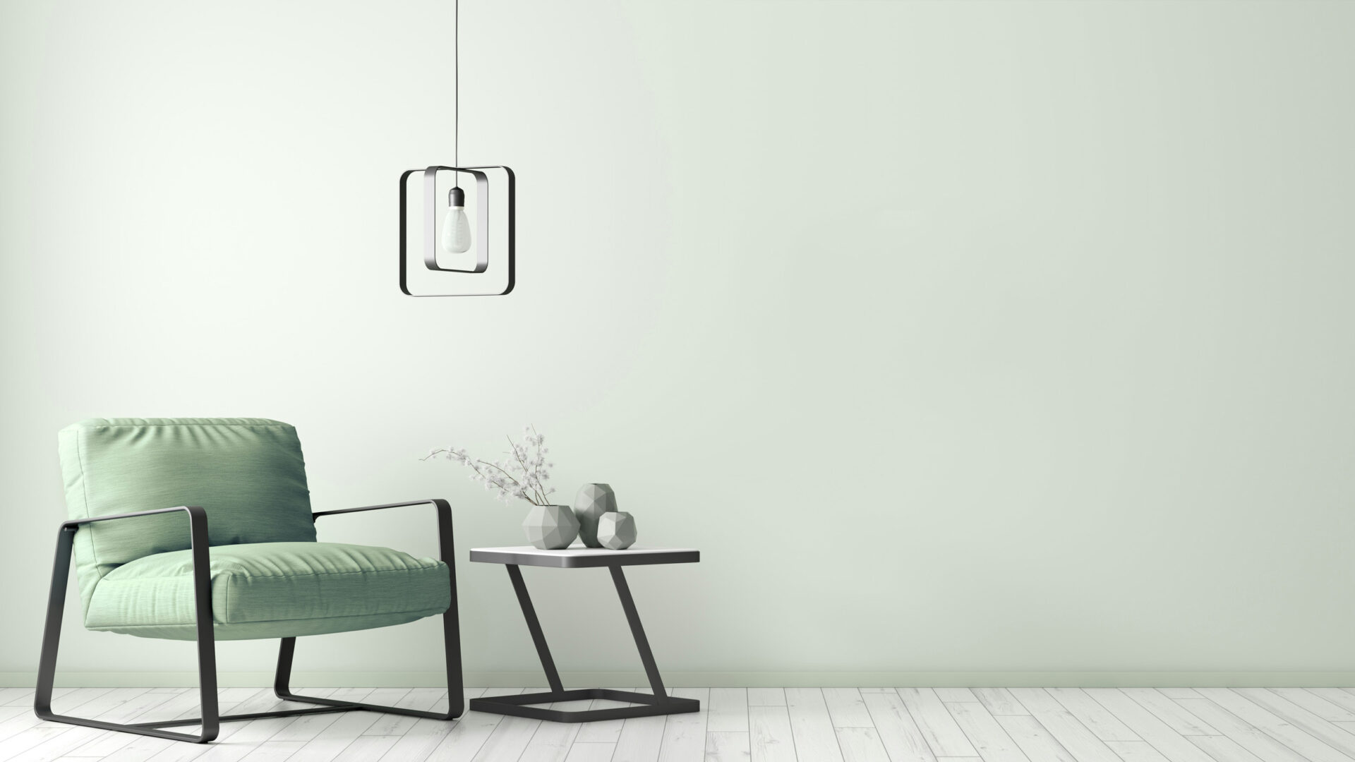 green chair against a light green wall