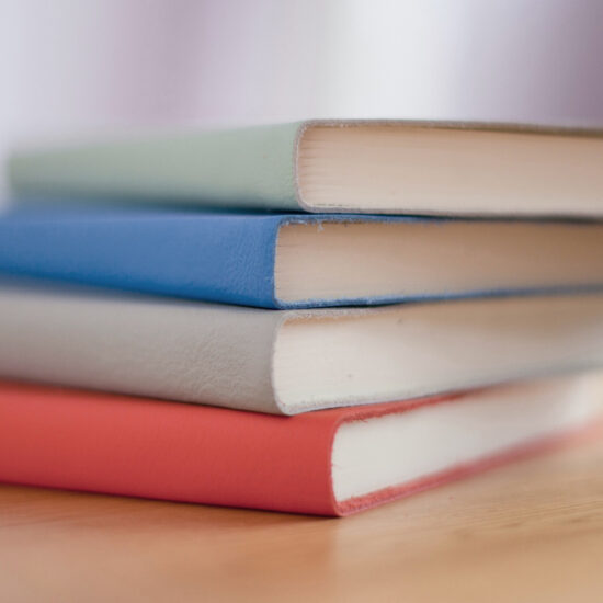 pile of pastel coloured notebooks